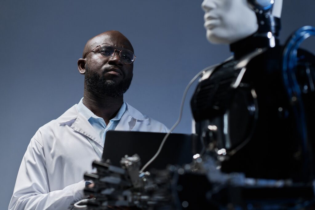 Engineer examining the artificial intelligence of robot