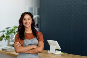Small business owner at a cash register
